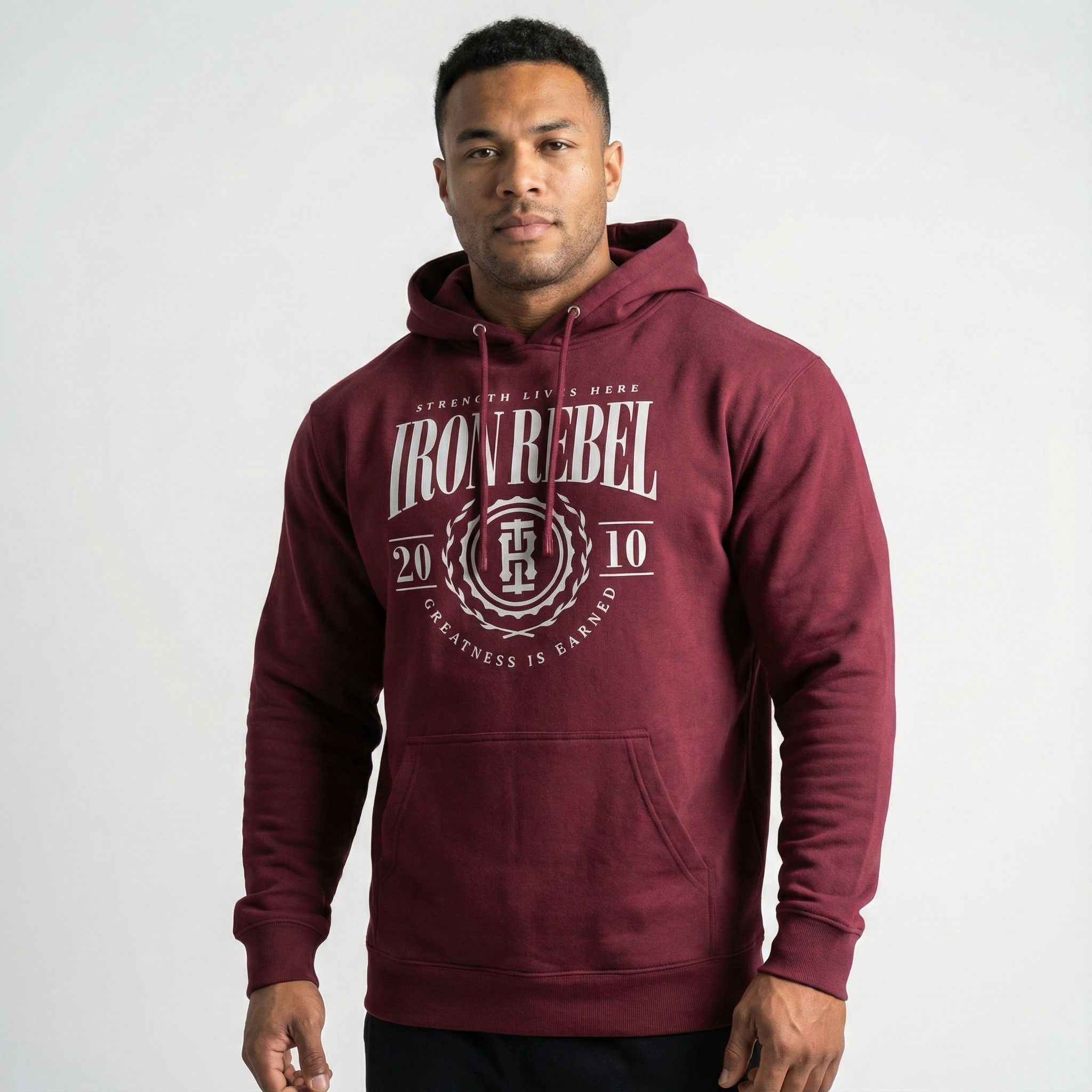 Iron Rebel maroon pullover hoodie for men featuring vintage strength crest graphic, premium gym sweatshirt front view, bodybuilding and powerlifting apparel
